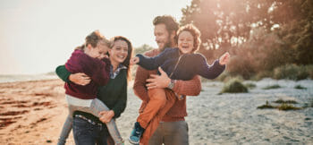 TruStage Family Having Fun At The Beach